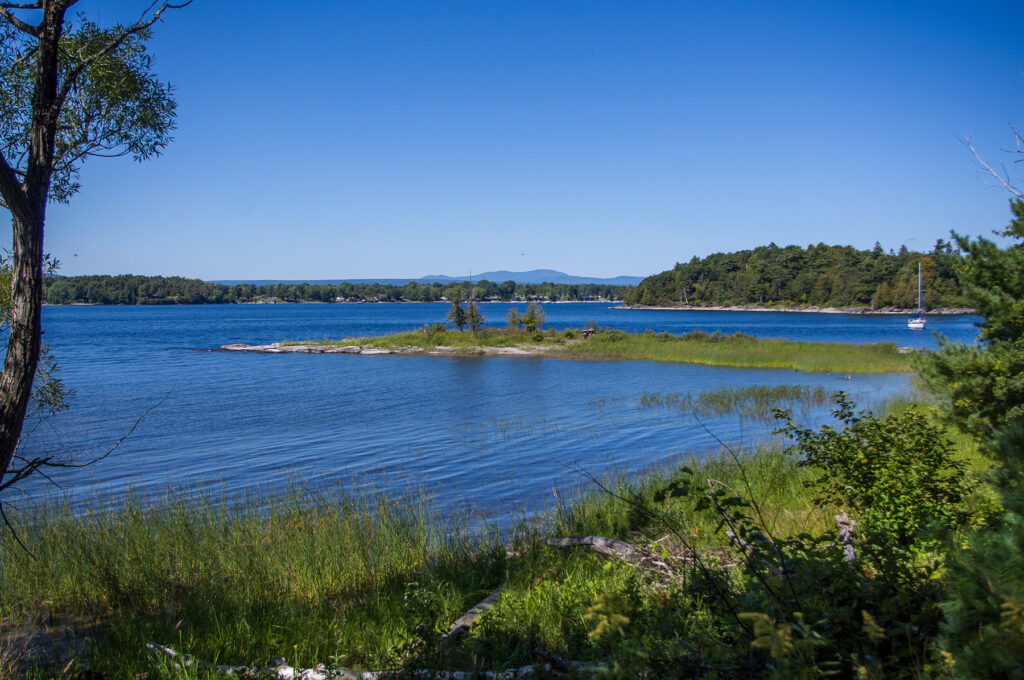 Wide view of the marina at Valcour Island, highlighting docks and surrounding natural beauty.